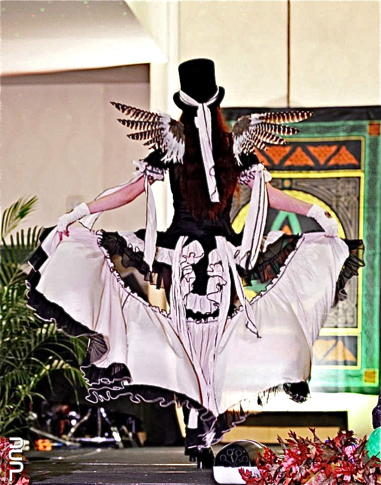 woman on runway in steampunk burlesque fairy costume by Accentuates Clothing