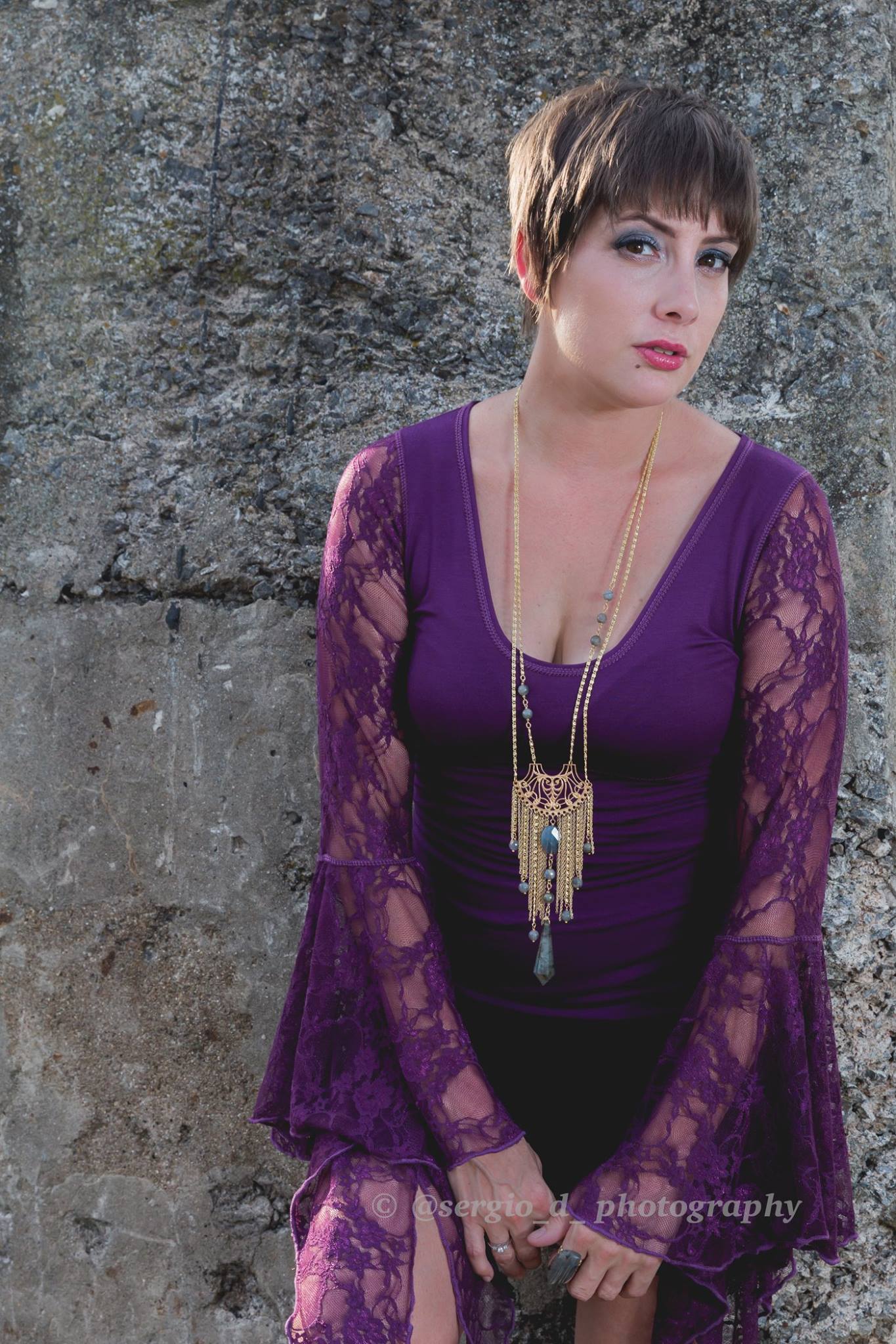 woman in purple lace sleeve top by Accentuates Clothing