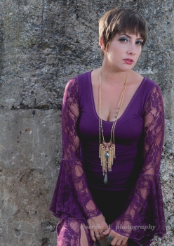 woman in purple lace sleeve top by Accentuates Clothing