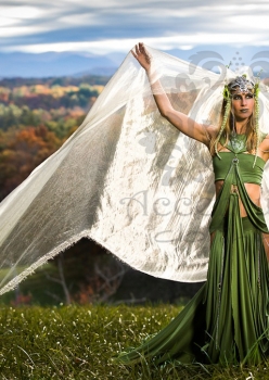 woman in field wearing meadow deva costume with giant veil by Accentuates Clothing